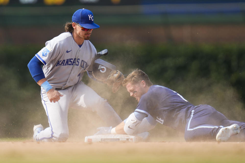 Kansas City Royals shortstop Bobby Witt Jr., left, tags out Chicago Cubs' Nico Hoerner at second during the ninth inning of a baseball game Friday, Aug. 18, 2023, in Chicago. Hoerner tried to stretch a single into a double. (AP Photo/Erin Hooley)