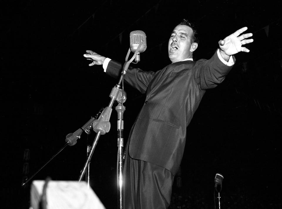 Tennessee Ernie Ford is rocking the Fairgrounds Coliseum with music, laughter and showmanship before a record-breaking "Furbelows and Fanfare' audiences March 3, 1961. One of his biggest hits is "Sixteen Tons."