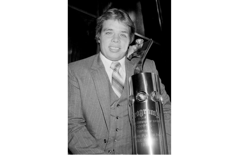 FILE - New York Jets defensive end Joe Klecko poses with the Seagram's Seven Crowns of Sports award for outstanding defensive player in the National Football League, in New York, Feb. 16, 1982. After a 35-year wait, the only player in NFL history to be selected to the Pro Bowl at three positions on the defensive line will be inducted into the Pro Football Hall of Fame. (AP Photo/Dave Pickoff, File)