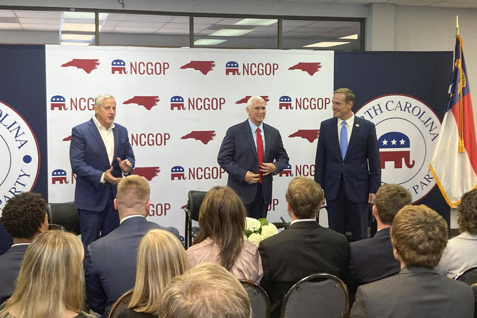 Former Vice President Mike Pence, center, joins with North Carolina Republican Party Chairman Michael Whatley, left, and U.S. Senate candidate Ted Budd for a conservation at the state GOP headquarters in Raleigh, N.C., on Wednesday. Nov. 2, 2022. Pence was in North Carolina to support Budd’s campaign. (AP Photo/Gary D. Robertson)