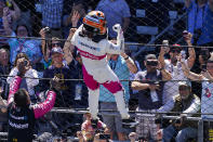 Helio Castroneves of Brazil celebrates after winning the Indianapolis 500 auto race at Indianapolis Motor Speedway in Indianapolis, Sunday, May 30, 2021. (AP Photo/Darron Cummings)