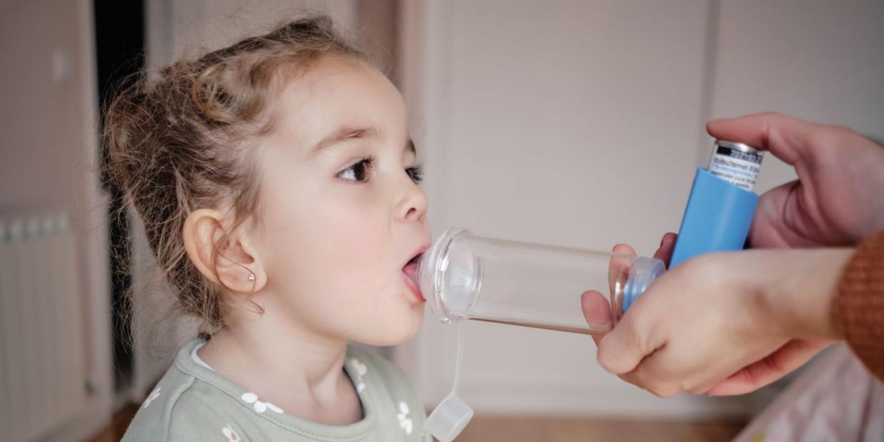 young girl receiving respiratory treatment at home