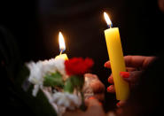 <p>Demonstrators hold candles as they take part in a demonstration against the murder of journalist Javier Valdez, and for other journalists who were killed in Mexico, at the Interior Ministry building in Mexico City, Mexico on May 16, 2017. (Henry Romero/Reuters) </p>