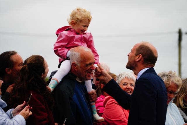 The Prince of Wales meets a young girl on a visit to Llanelli