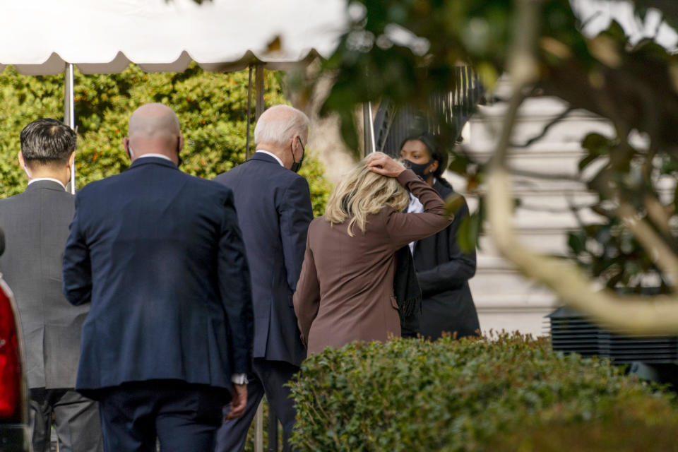 President Joe Biden and first lady Jill Biden arrive back at the White House after the first lady went to an appointment for a "common medical procedure" at an outpatient center in Washington, Wednesday, April 14, 2021. The Bidens were scheduled to go to an outpatient center in downtown Washington, which the White House did not identify. (AP Photo/Andrew Harnik)