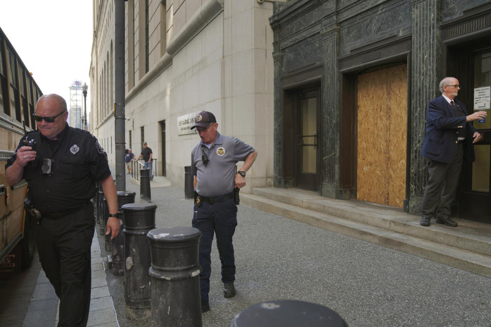 Security teams let community members into the Federal courthouse in Pittsburgh for the first day of trial for Robert Bowers, the suspect in the 2018 synagogue massacre on Tuesday, May 30, 2023, in Pittsburgh. Bowers could face the death penalty if convicted of some of the 63 counts he faces which claimed the lives of worshippers from three congregations who were sharing the building, Dor Hadash, New Light and Tree of Life. (AP Photo/Jessie Wardarski)