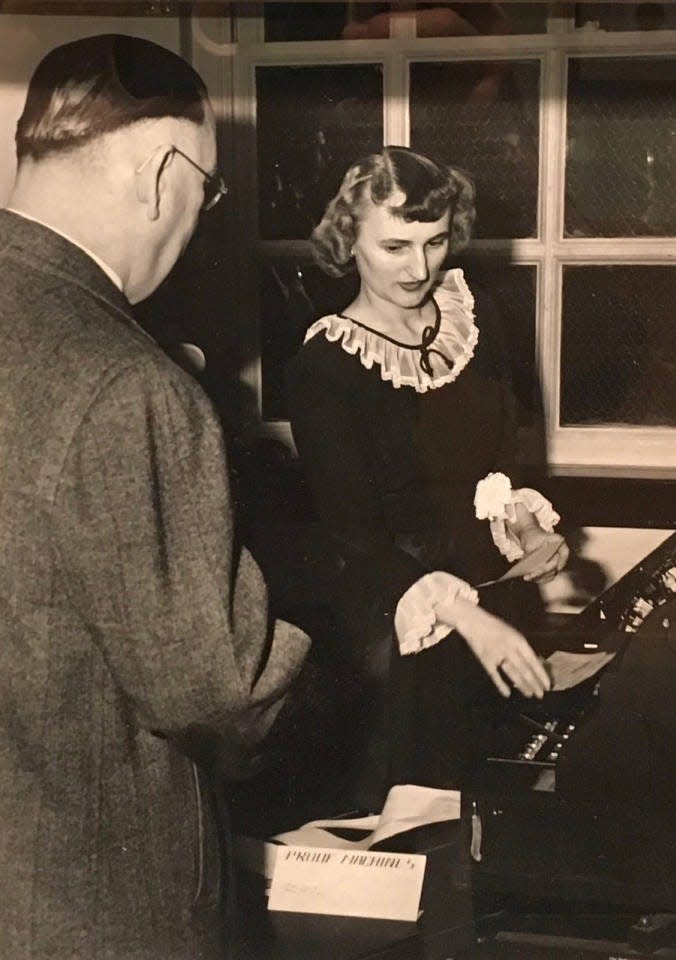 A demonstration of the new check proofing technology used at Monroe State Savings Bank (now First Merchants Bank), circa 1950s, is pictured.