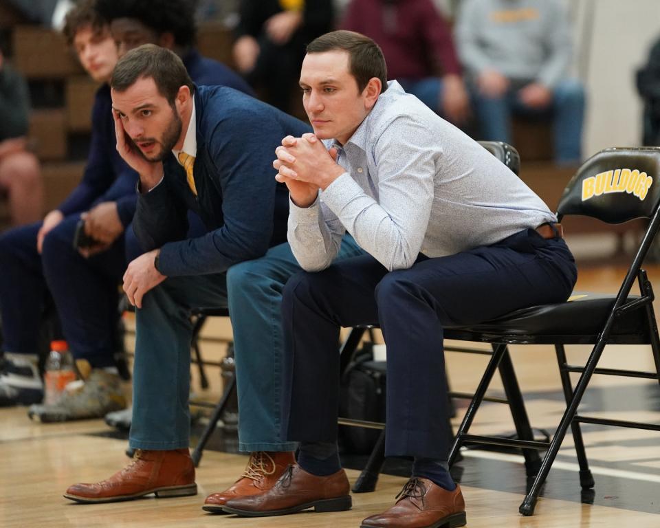 Siena Heights men's wrestling coach Derrik Marry (Hudson), right, looks on during his team's dual meet at Adrian College on Saturday, Dec. 11.