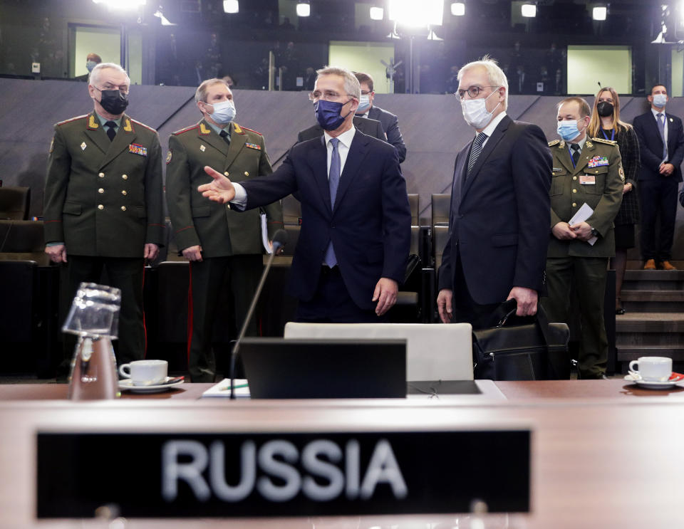 NATO Secretary General Jens Stoltenberg, center, and Russia's Deputy Foreign Minister Alexander Grushko, fourth right, arrive for the NATO-Russia Council at NATO headquarters, in Brussels, Wednesday, Jan. 12, 2022. Senior NATO and Russian officials are meeting Wednesday to try to bridge seemingly irreconcilable differences over the future of Ukraine, amid deep skepticism that Russian President Vladimir Putin's security proposals for easing tensions are genuine. (Olivier Hoslet, Pool Photo via AP)