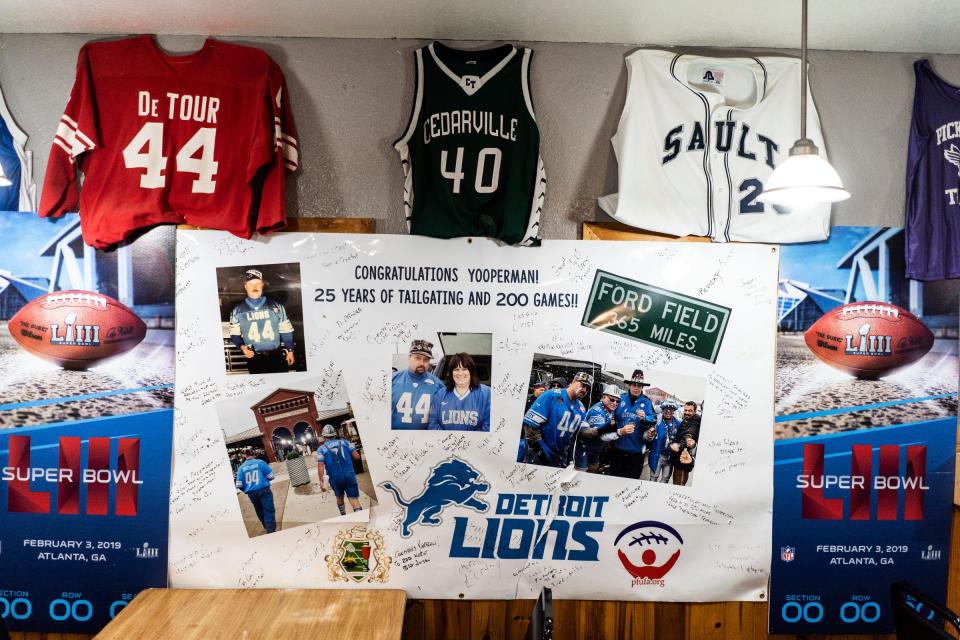 Keepsakes from a ceremony honoring Donnie Stefanski for attending 200 Detroit Lions home games in a row are displayed inside Yooperman's Bar and Grill in Goetzville, in Michigan's Upper Peninsula, on Aug. 30, 2023.