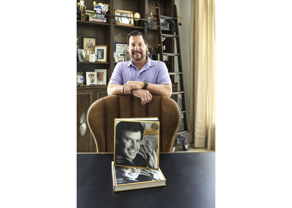 This photo provided by Foxglove Communications shows Al Copeland Jr. with his cookbook "Secrets of a Tastemaker: Al Copeland, The Cookbook." (Sam Hanna/Foxglove Communications via AP)