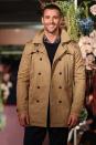 Fresh out the jungle, Kris Smith was all smiles as he took to the Myer runway in a beige trench coat.