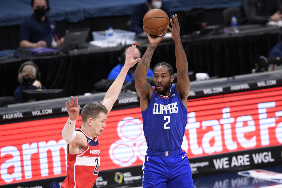 Los Angeles Clippers forward Kawhi Leonard (2) shoots against Washington Wizards center Moritz Wagner, left, during the second half of an NBA basketball game, Thursday, March 4, 2021, in Washington. (AP Photo/Nick Wass)