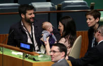 New Zealand Prime Minister Jacinda Ardern holds her baby after speaking at the Nelson Mandela Peace Summit during the 73rd United Nations General Assembly in New York, U.S., September 24, 2018. REUTERS/Carlo Allegri