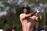 Tiger Woods watches his tee shot on the second hole during the first round of the PNC Championship golf tournament Saturday, Dec. 18, 2021, in Orlando, Fla. (AP Photo/Scott Audette)