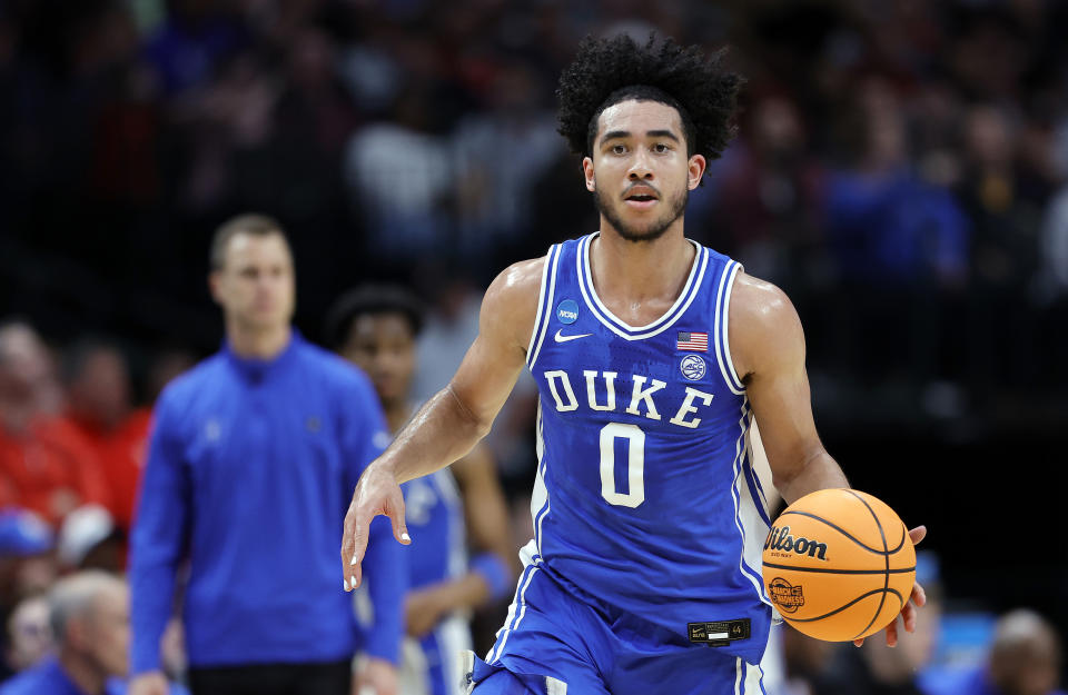 DALLAS, TEXAS - MARCH 29: Jared McCain #0 of the Duke Blue Devils controls the ball during the 1st half of the Sweet 16 round of the NCAA Men's Basketball Tournament game against the Houston Cougars at American Airlines Center on March 29, 2024 in Dallas, Texas. (Photo by Carmen Mandato/Getty Images)