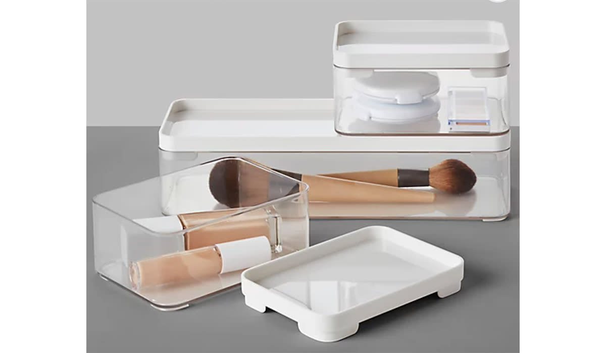 Beauty tools and makeup stored in stackable bins