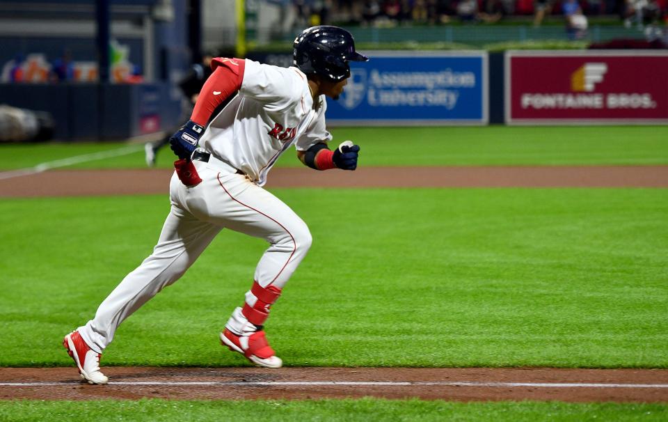 WORCESTER - Enmanuel Valdez singles as the Worcester Red Sox play the Syracuse Mets on Wednesday night.