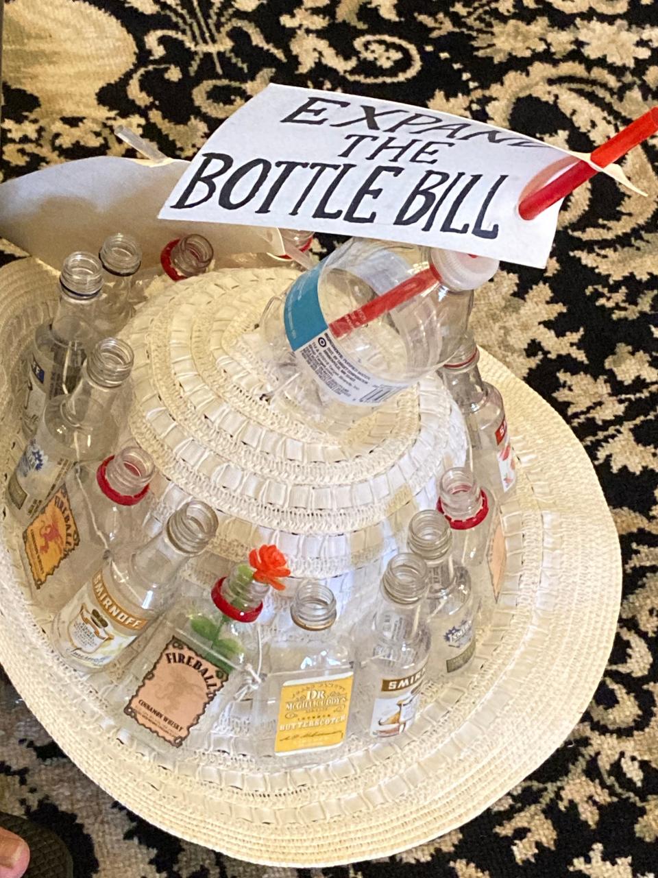 The hat belonging to Eileen Ryan, the leader of Beyond Plastics in Greater Boston, a Watertown resident, decorated by some of the single-use plastics targeted by the coalition aiming to update the state's Bottle Bill as well as reduce the use of certain plastics