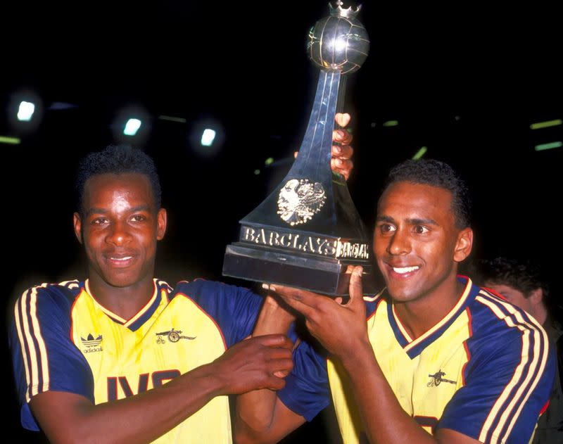 FILE PHOTO: Arsenal's Michael Thomas and David Rocastle hold up the first division trophy following a 2-0 win over fellow title contenders Liverpool at Anfield on the last day of the 1988-89 league season.