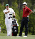 Caddie Steve Williams gives directions to Adam Scott, of Australia, on the first fairway during the second round of the Masters golf tournament Friday, April 11, 2014, in Augusta, Ga. (AP Photo/Darron Cummings)