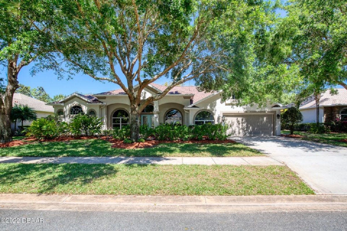 This lovely golf course-front pool home in the desirable Halifax Plantation community in Ormond Beach has three bedrooms, three baths and a two-and-a-half-car garage.