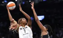 Indiana Fever forward Aliyah Boston (7) shoots over New York Liberty forward Jonquel Jones (35) during the first half of a WNBA basketball game, Saturday, May 18, 2024, in New York. (AP Photo/Noah K. Murray)