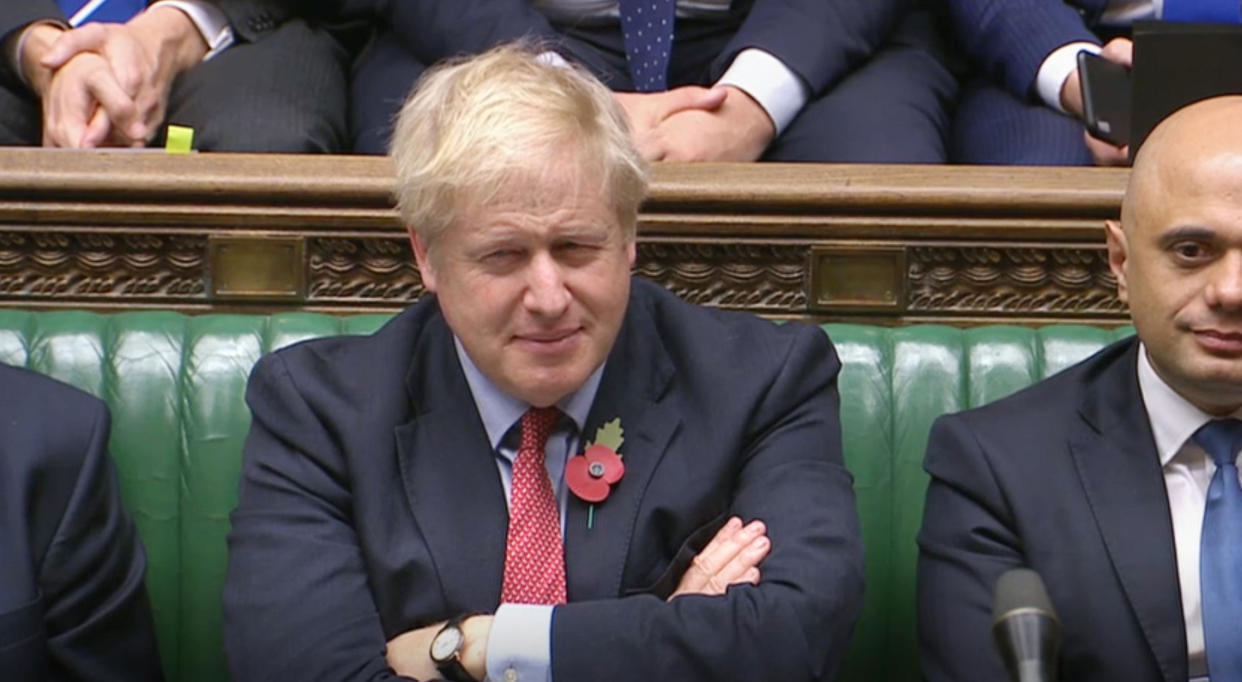 Prime Minister Boris Johnson listens to Labour leader Jeremy Corbyn speaking in the House of Commons, London.