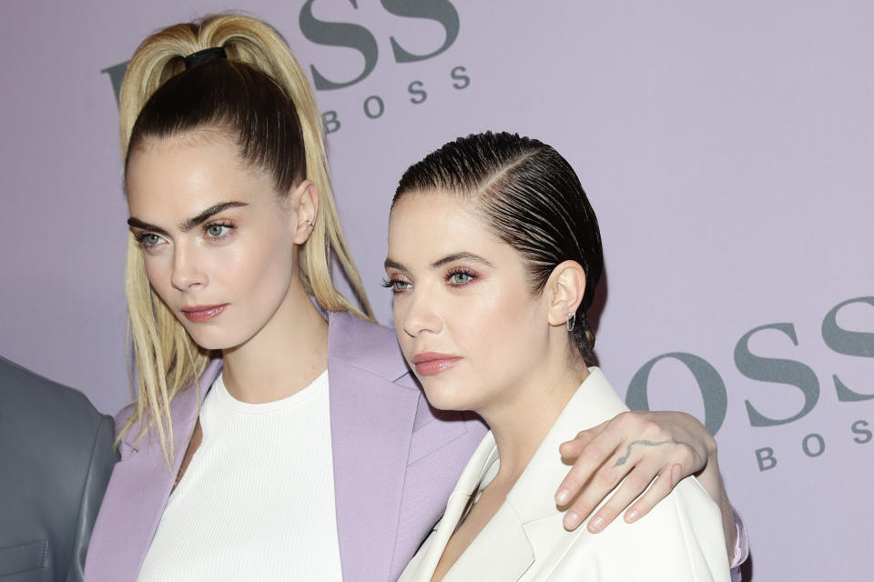 Cara Delevingne and Ashley Benson attend the BOSS fashion show during the Milan Fashion Week Fall/Winter 2020 - 2021 on February 23, 2020 in Milan, Italy. (Photo by Vittorio Zunino Celotto/Getty Images for Hugo Boss )