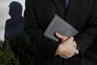 <p>An attendee holds a program while awaiting the start of funeral service for evangelist Billy Graham at the Billy Graham Library in Charlotte, N.C., March 2, 2018. (Photo: Jonathan Drake/Reuters) </p>