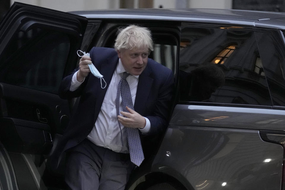 Britain's Prime Minister Boris Johnson arrives back at 10 Downing Street in London, Tuesday, Jan. 25, 2022. London police say they are investigating Downing Street lockdown parties in 2020 to determine if U.K. government officials violated coronavirus restrictions. Tuesday's announcement puts further pressure on British Prime Minister Boris Johnson. (AP Photo/Alastair Grant)