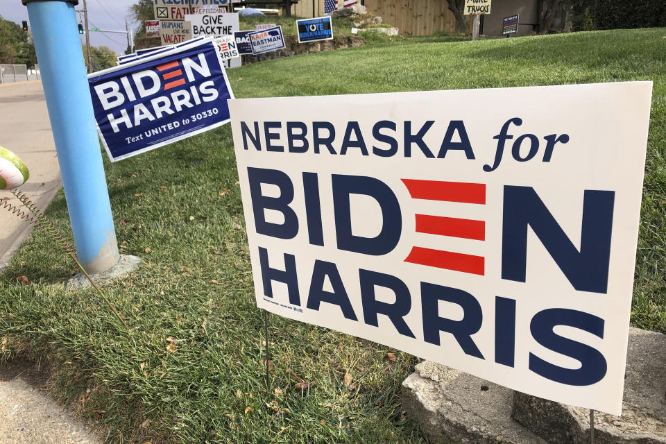 A Joe Biden presidential campaign sign greets passersby in a leafy neighborhood of Omaha, Neb., Monday, Oct. 19, 2020. If the election is close, Nebraska could play a pivotal role in deciding the winner because the state is able to divide its electoral votes, as it did when President Barack Obama won the Omaha-based 2nd Congressional District in 2008. Maine is the only other state that awards Electoral College votes by congressional district, and it could go the opposite way and award a vote to Donald Trump even as the state as a whole likely will go to Biden. (AP Photo/Grant Schulte)