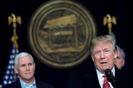 U.S. President Donald Trump speaks to the media next to Vice President Mike Pence after the Congressional Republican Leadership retreat at Camp David, Maryland, U.S., January 6, 2018. REUTERS/Yuri Gripas