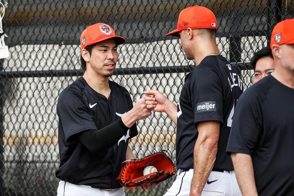 Detroit Tigers pitcher Kenta Maeda, left, fist bumps pitcher Jack Flaherty during spring training at TigerTown in Lakeland, Fla. on Thursday, Feb. 15, 2024.