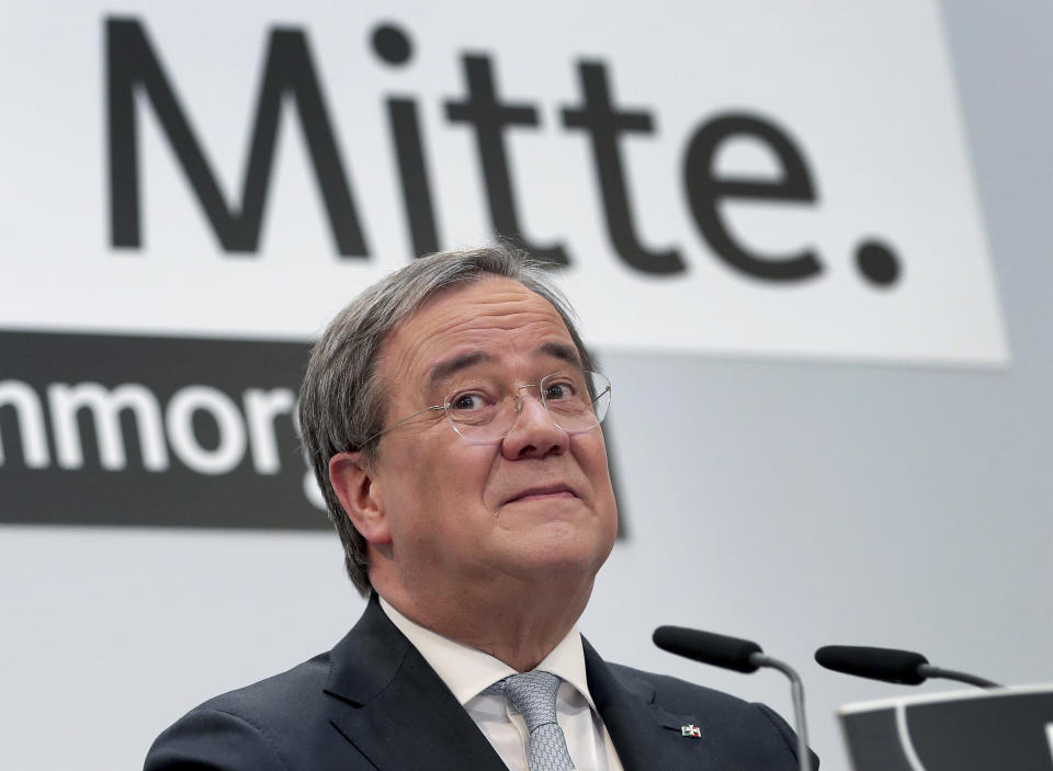 Armin Laschet, chairman of the German Christian Democratic Union, CDU, addresses the media during a press conference at the party's headquarters in Berlin, Germany, Monday, Jan. 25, 2021. Word on top reads 'Center'. (AP Photo/Michael Sohn, pool)