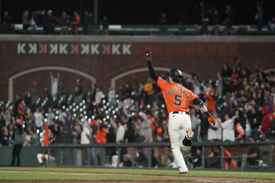 San Francisco Giants' Mike Yastrzemski runs the bases after hitting a grand slam against the Milwaukee Brewers during the ninth inning of a baseball game in San Francisco, Friday, July 15, 2022. The Giants won 8-5. (AP Photo/Godofredo A. Vásquez)