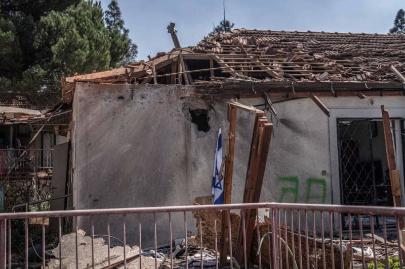 A view of a damaged building following a rocket from Lebanon hit a house in Safed. Ilia Yefimovich/dpa