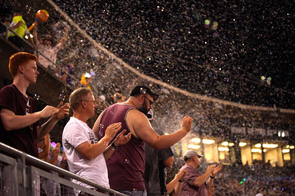 Texas A&M Aggies fans celebrate a homer against the Texas Longhorns during the second round in the NCAA baseball College Station Regional on June 1, 2024 at Olsen Field College Station.