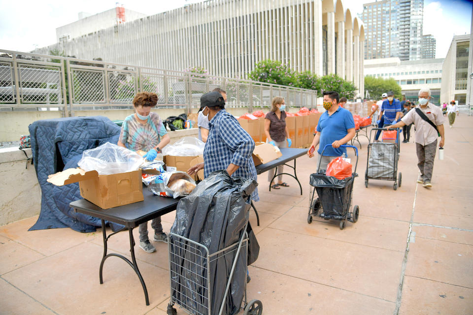 New Yorkers in need receive free produce, dry goods, and meat at a Food Bank For New York City distribution event at Lincoln Center on July 29, 2020, in New York City. (Photo by Michael Loccisano/Getty Images for Food Bank For New York City)