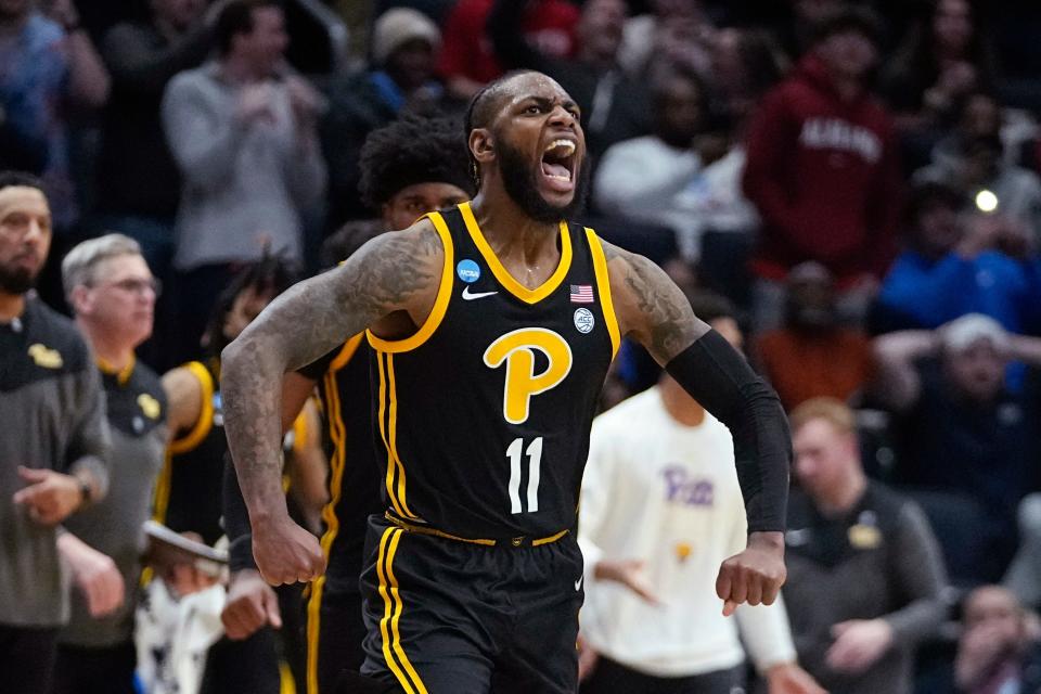 Pittsburgh's Jamarius Burton reacts after hitting the game-winning shot.