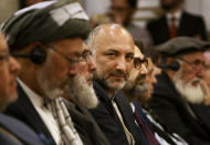 Afghan politician Haneef Atmar, center, and others attends the opening session of an Afghan Peace Conference in Bhurban, 65 kilometers (40 miles) north of Islamabad, Pakistan, Saturday, June 22, 2019. Dozens of Afghan political leaders attended a peace conference in neighboring Pakistan on Saturday to pave the way for further Afghan-to-Afghan dialogue. (AP Photo/Anjum Naveed)