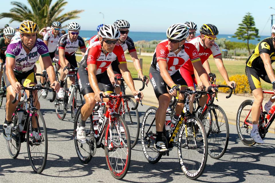 Lance Armstrong of the US (C-R) and Robbie McEwen from Australia (C-L) take part in a ride with members of the public in prepartation for upcoming the Tour Down Under cycling event in Adelaide on 15 January 2011. The Tour Down Under cycling event will be held from January 16-23. IMAGE STRICTLY RESTRICTED TO EDITORIAL USE STRICTLY NO COMMERCIAL USE AFP PHOTO / MARK GUNTER (Photo credit should read Mark Gunter/AFP/Getty Images)