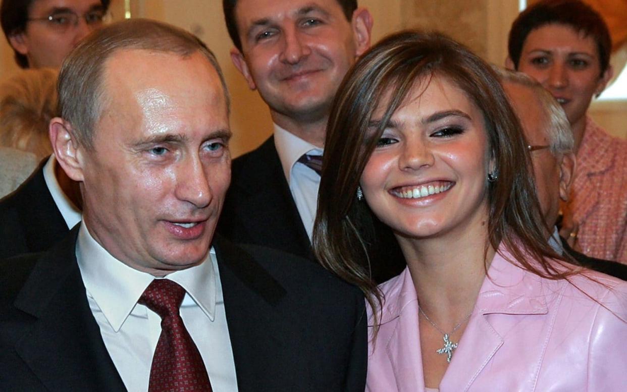 Alina Kabaeva and Vladimir Putin at an event in Kremlin - Kremlin.ru