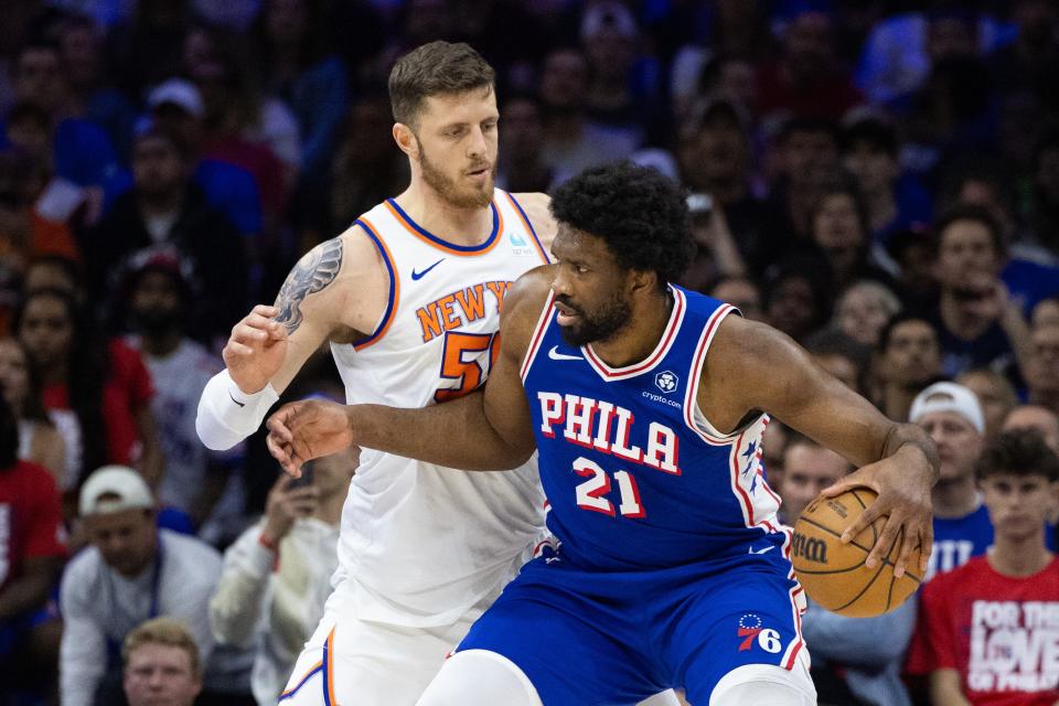 May 2, 2024; Philadelphia, Pennsylvania, USA; Philadelphia 76ers center Joel Embiid (21) controls the ball against New York Knicks center Isaiah Hartenstein (55) during the first half of game six of the first round for the 2024 NBA playoffs at Wells Fargo Center.