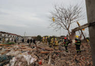 <p>Rescue workers search at the site of an explosion in Ningbo, China’s eastern Zhejiang province on Nov. 26, 2017. (Photo: STR/AFP/Getty Images) </p>