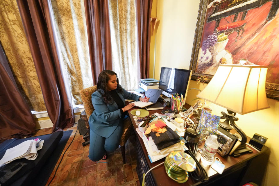 Ashley K. Shelton, executive director of Power Coalition for Equity & Justice in Louisiana, a voter advocacy organization that is trying to get left-leaning voters engaged for next year's elections, possess for a photo at her family home in Baton Rouge, La., Tuesday, Dec. 26, 2023. (AP Photo/Gerald Herbert)