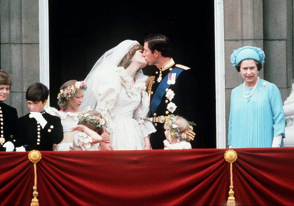 Prince Charles And Princess Diana Kissing On The Balcony Of Buckingham Palace On Their Wedding Day.