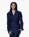 <p>Singing her collaboration with Paul McCartney and Kanye West for the first time live, Rihanna rung in the occasion in a custom John Galliano for Margiela suit. The navy blue oversized blazer, worn without a bra, and wide-leg trousers, was suprisingly sexy.</p>