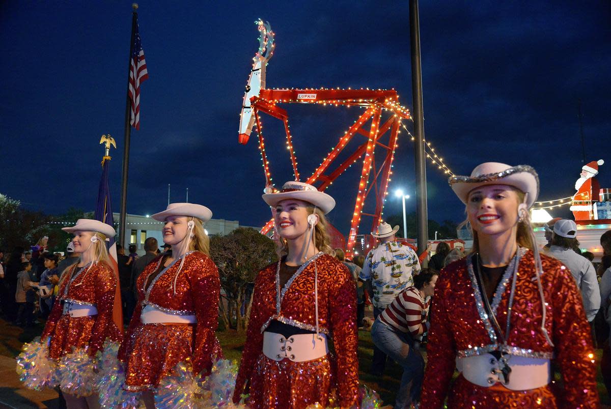 The Huntington High School High Steppers drill team stands at attention at the Rudolph the Red Nosed Pumping Unit lighting ceremony in downtown Lufkin on Friday, Dec. 1, 2023.