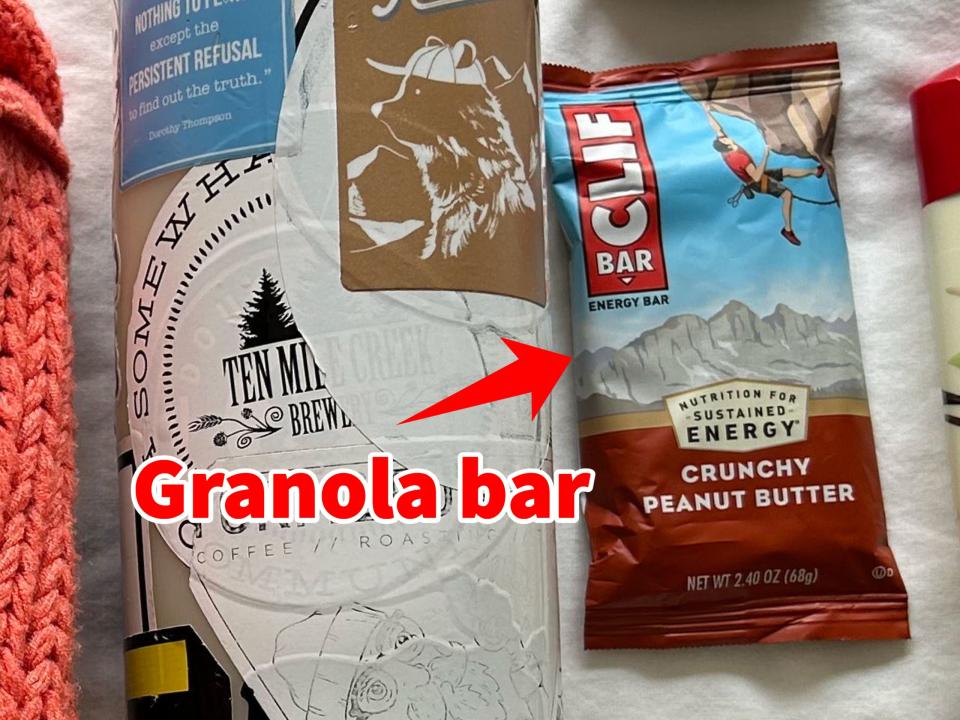 A small arrow pointing to a Clif Bar.